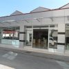 Homlokzatra szerelhető konzolos előtető